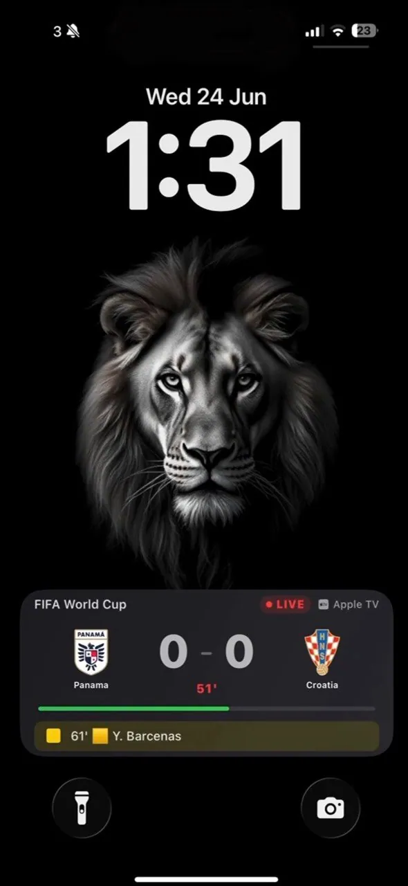 iPhone Lock Screen showing a live World Cup score from OneTV Connect: Panama 0–0 Croatia, 51st minute, yellow card